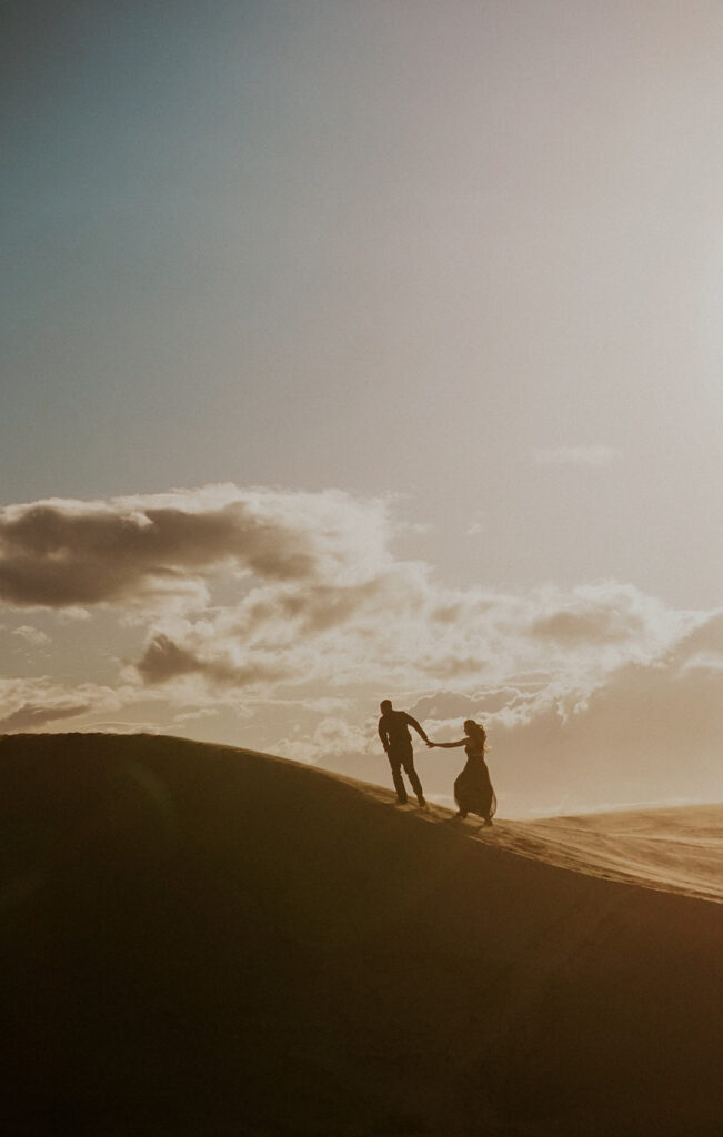 Walking through Central Oregon dunes for this moody adventure elopement.