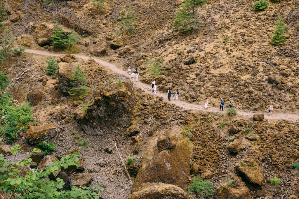 Guests hiking in on the trail that leads to Wahclella Falls, the elopement location.
